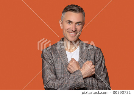 Man touching chest with his fists Man touching chest with his fists 80590721