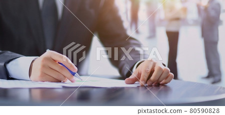 Closeup of human hand writing on a paper. Closeup of human hand writing on a paper. 80590828