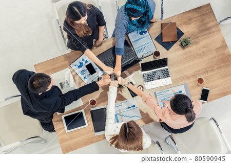Teamwork business people join hands in meeting. Teamwork business people join hands in meeting. 80590945