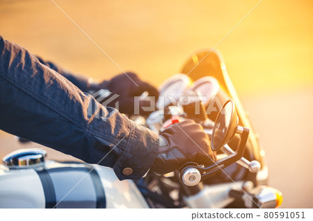On the route to a summer vacation on a motorcycle, View that has been cropped Close-up of the classic motorcycle's control handle 80591051