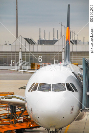 preparing for the flight. an aircraft at the gateway in the handling position preparing for the flight. an aircraft at the gateway in the handling position 80591205