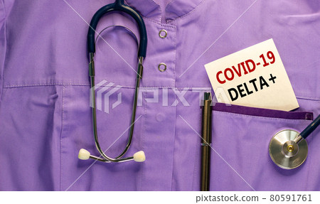 Covid-19 delta plus variant symbol. Medical uniform, white card with words Covid-19 delta plus, metalic pen and stethoscope. Medical and Covid-19 delta plus strain virus concept. Covid-19 delta plus variant symbol. Medical uniform, white card with words Covid-19 delta plus, metalic pen and stethoscope. Medical and Covid-19 delta plus strain virus concept. 80591761