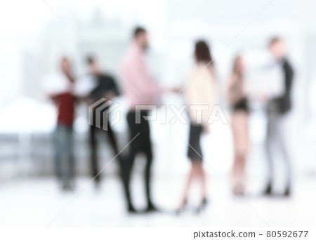 background image of a business team talking in the office hall 80592677
