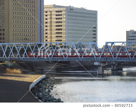 Kawasaki City, Kanagawa Prefecture Commuter train crossing an iron bridge Kawasaki City, Kanagawa Prefecture Commuter train crossing an iron bridge 80592715