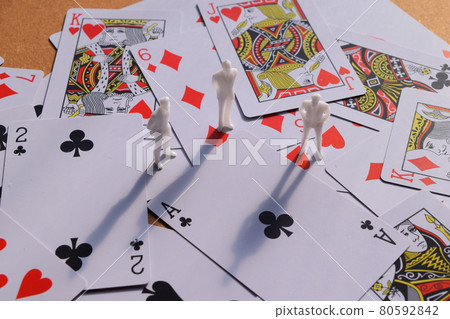 Human figures and playing cards Human figures and playing cards 80592842