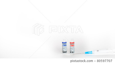 The coronavirus vaccine is in the hands of a doctor, a syringe The coronavirus vaccine is in the hands of a doctor, a syringe 80597707