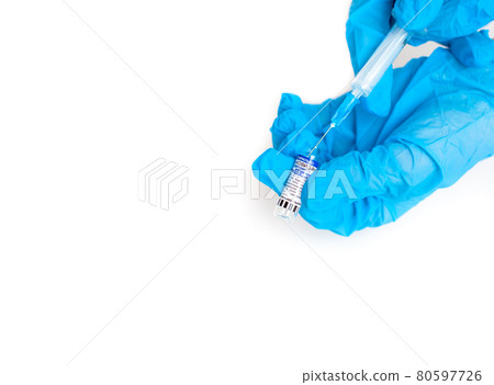 The coronavirus vaccine is in the hands of a doctor, a syringe The coronavirus vaccine is in the hands of a doctor, a syringe 80597726
