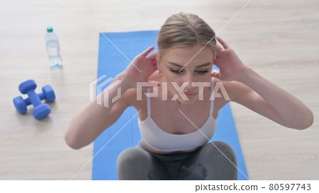 Close up of Woman doing Exercise on Yoga Mat 80597743