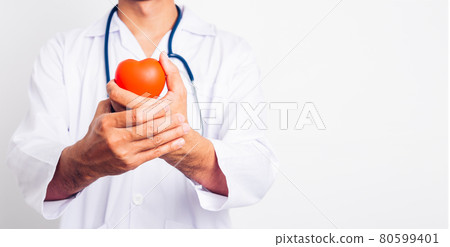 Close up Man doctor with stethoscope he is holding red heart on hand Close up Man doctor with stethoscope he is holding red heart on hand 80599401