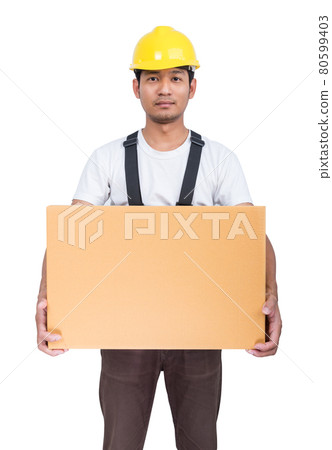 Smiling man lifts a cardboard box wearing back support belt Smiling man lifts a cardboard box wearing back support belt 80599403
