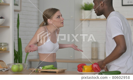 Fighting Woman Arguing with African Man in Kitchen Fighting Woman Arguing with African Man in Kitchen 80602958