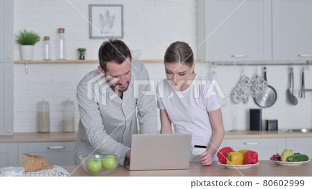 Woman and Man Doing Online Shopping on Laptop 80602999