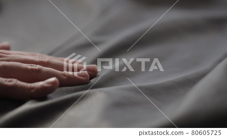 Closeup man touching fine leather Closeup man touching fine leather 80605725