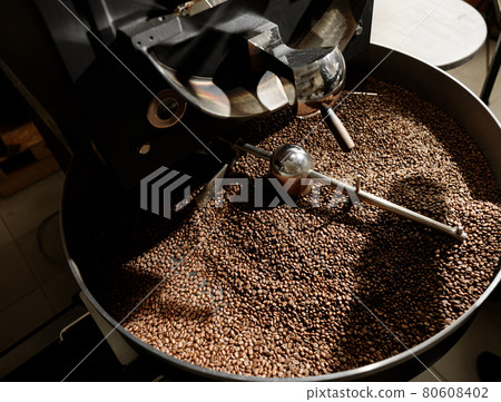Coffee processing. Roastery, roasting machine and fresh beans Coffee processing. Roastery, roasting machine and fresh beans 80608402