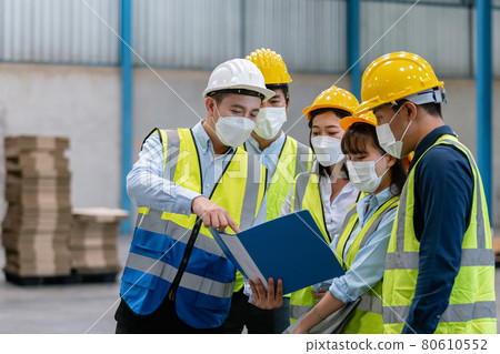 Team engineer in uniform wear protection mask brainstorming workshop industrial factory building. Team engineer in uniform wear protection mask brainstorming workshop industrial factory building. 80610552