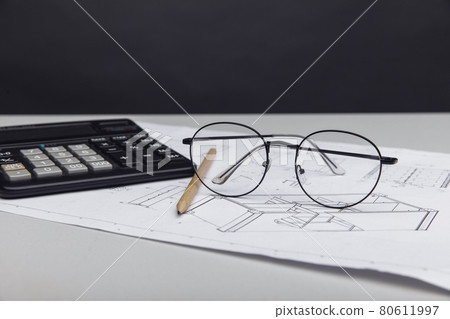 Architectural project, glasses and calculator Architectural project, glasses and calculator 80611997