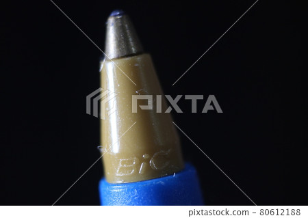 Macro photo of ballpoint pen tip with dark grey background. Macro photo of ballpoint pen tip with dark grey background. 80612188