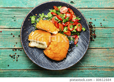Chicken kiev cutlet with salad Chicken kiev cutlet with salad 80612884