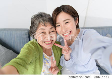 Senior woman, young woman, smile, good friend, selfie Senior woman, young woman, smile, good friend, selfie 80614447