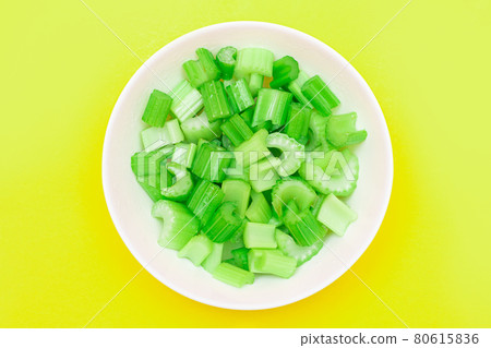 Fresh Chopped Celery Peaces with Water Drops in White Bowl Fresh Chopped Celery Peaces with Water Drops in White Bowl 80615836