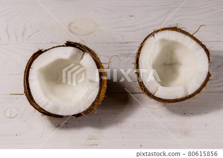 Fresh ripe coconut on white wooden table 80615856
