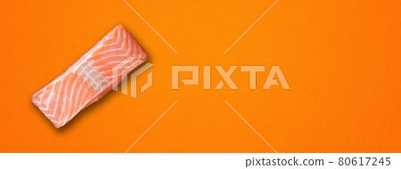 Salmon steak on orange background. Horizontal banner Salmon steak on orange background. Horizontal banner 80617245