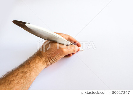 hand writing with a bird feather 80617247