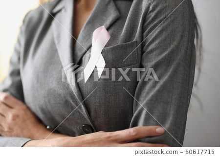 Symbol of pink ribbon on female breast Symbol of pink ribbon on female breast 80617715