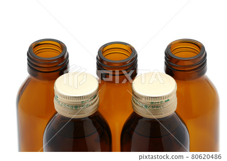 Energy drinks: bottles with open lids and empty bottles 80620486