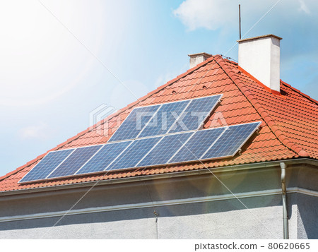 Solar roof panels with the sun flares on sky. Popular solar energy panels 80620665