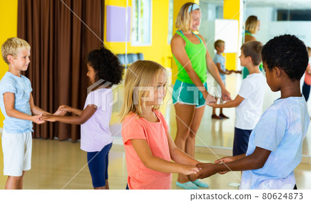 Little boys and girls dancing pair dance in the ballet studio Little boys and girls dancing pair dance in the ballet studio 80624873