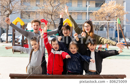 Portrait of happy kids standing together on playground in spring day Portrait of happy kids standing together on playground in spring day 80625009