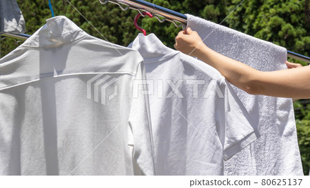 Dry the laundry in the garden on a sunny day Dry the laundry in the garden on a sunny day 80625137