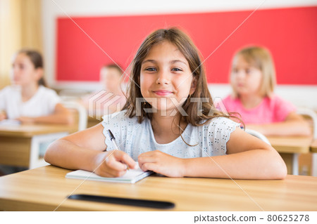 Young girl in classroom Young girl in classroom 80625278