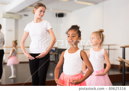 Ballet teacher and two little girls Ballet teacher and two little girls 80625316