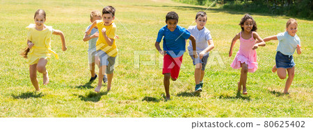 Cheerful kids are jogging together in the park Cheerful kids are jogging together in the park 80625402