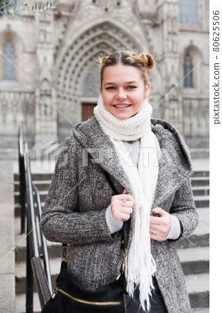 Cheerful young girl in scarf at the street 80625506