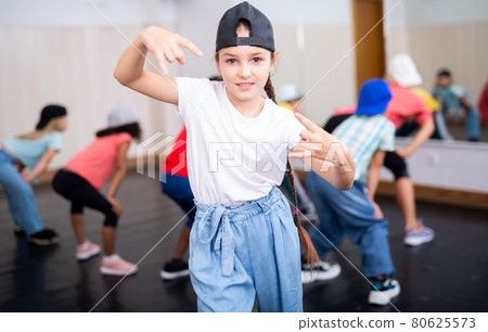 Girl hip hop dancer posing at class Girl hip hop dancer posing at class 80625573