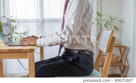 A man in the right posture. A businessman who works at home. A man in the right posture. A businessman who works at home. 80625807