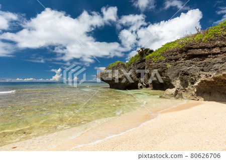 Gorgeous paradise beach, crystal clear sea, coastal rocks, blue sky full of scattered clouds. Iriomote Island. Gorgeous paradise beach, crystal clear sea, coastal rocks, blue sky full of scattered clouds. Iriomote Island. 80626706