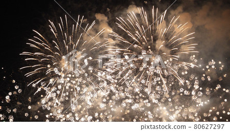 Golden Firework celebrate anniversary happy new year 2022, 4th of july holiday festival. Gold firework in the night time celebrate national holiday. Countdown to new year 2022 gold party time event Golden Firework celebrate anniversary happy new year 2022, 4th of july holiday festival. Gold firework in the night time celebrate national holiday. Countdown to new year 2022 gold party time event 80627297