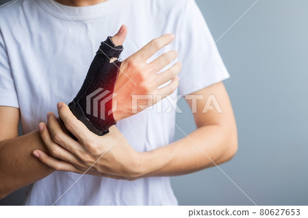 woman holding her wrist pain because using smartphone or computer long time. De Quervain's tenosynovitis, Intersection Symptom, Carpal Tunnel Syndrome or Office syndrome concept 80627653
