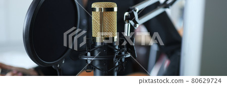 Gold modern professional studio microphone closeup background 80629724