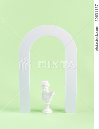Geometric shape white arch and woman antique statue bust on green background Geometric shape white arch and woman antique statue bust on green background 80631187