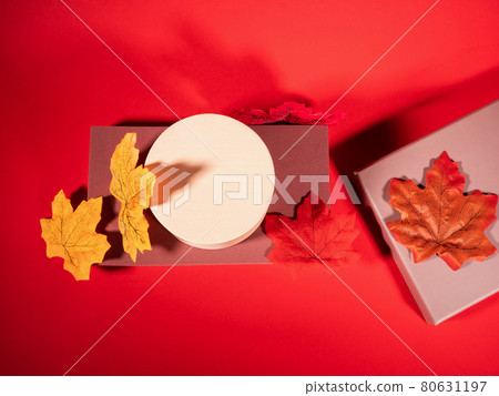 Autumn trendy background. Red and brown geometric shape scene with fall leaves 80631197