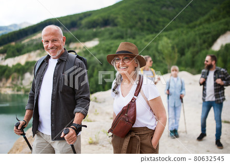 Happy multigeneration family on hiking trip on summer holiday, walking. Happy multigeneration family on hiking trip on summer holiday, walking. 80632545