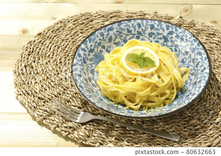 Lemon cream pasta and fork with lemon and spearmint cut into slices 80632663