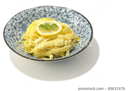 Photographed lemon cream pasta with lemon and spearmint cut into slices on a white background Photographed lemon cream pasta with lemon and spearmint cut into slices on a white background 80632876