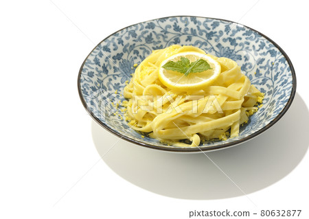 Photographed lemon cream pasta with lemon and spearmint cut into slices on a white background Photographed lemon cream pasta with lemon and spearmint cut into slices on a white background 80632877