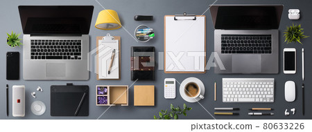 Flat lay top view office desk working space with laptop on gray background. Flat lay top view office desk working space with laptop on gray background. 80633226